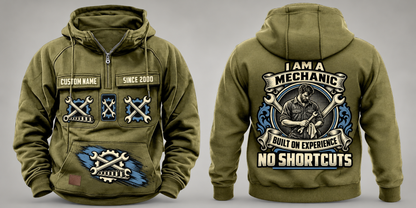 Mechanic Heritage Crest Vintage Hoodie in Military Green, complete front and back views with crossed-wrench and gear artwork, sample chest text CUSTOM NAME and SINCE 2000, and plain sleeves.