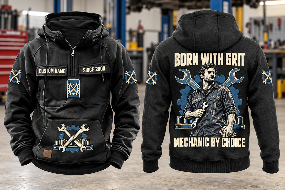 Mechanic By Choice Vintage Hoodie in Black, complete front and back views with sample text CUSTOM NAME and SINCE 2000, mechanic portrait, crossed wrenches, gear and socket-rail artwork in a quiet workshop.