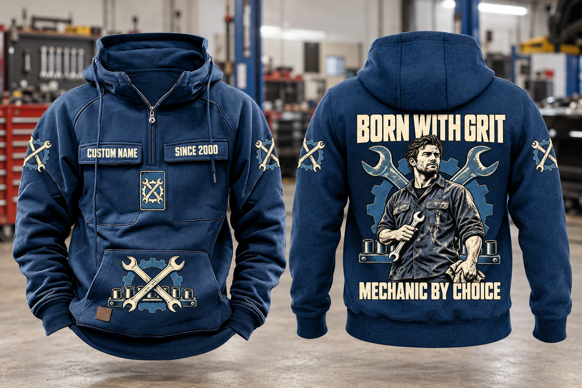 Mechanic By Choice Vintage Hoodie in Dark Blue, complete front and back views with sample text CUSTOM NAME and SINCE 2000, mechanic portrait, crossed wrenches, gear and socket-rail artwork in a quiet workshop.