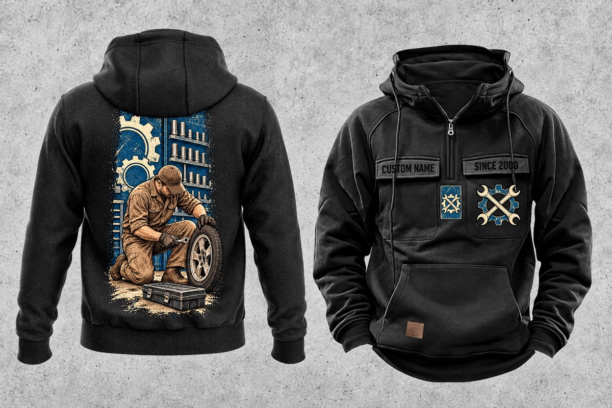 Mechanic Workday Portrait Vintage Hoodie in Black, separated front and back views with CUSTOM NAME and SINCE 2000 sample chest text, wrench-and-gear chest emblems, and a kneeling mechanic with wheel and closed tool case on a tall back panel.