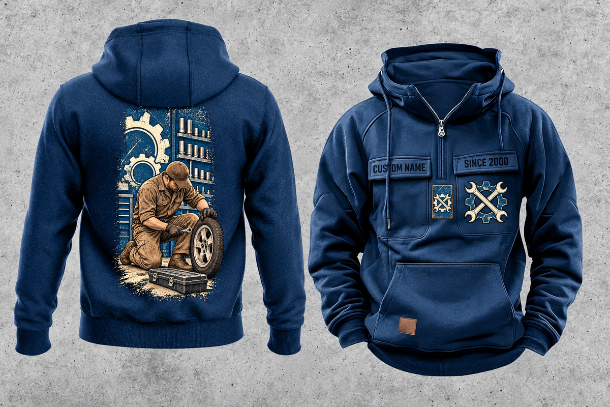 Mechanic Workday Portrait Vintage Hoodie in Dark Blue, separated front and back views with CUSTOM NAME and SINCE 2000 sample chest text, wrench-and-gear chest emblems, and a kneeling mechanic with wheel and closed tool case on a tall back panel.