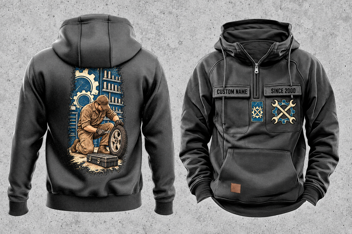 Mechanic Workday Portrait Vintage Hoodie in Dark Gray, separated front and back views with CUSTOM NAME and SINCE 2000 sample chest text, wrench-and-gear chest emblems, and a kneeling mechanic with wheel and closed tool case on a tall back panel.