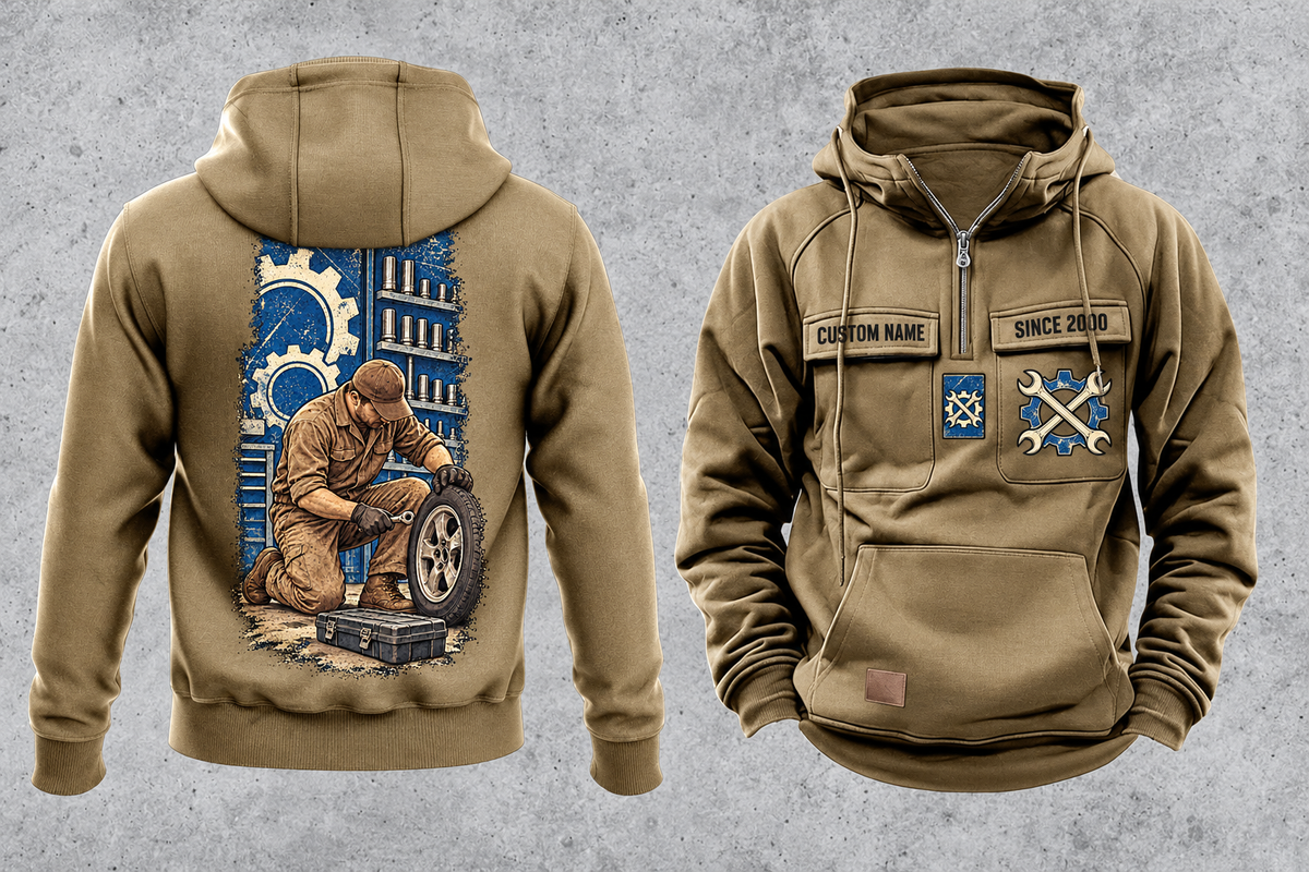Mechanic Workday Portrait Vintage Hoodie in Kaki, separated front and back views with CUSTOM NAME and SINCE 2000 sample chest text, wrench-and-gear chest emblems, and a kneeling mechanic with wheel and closed tool case on a tall back panel.