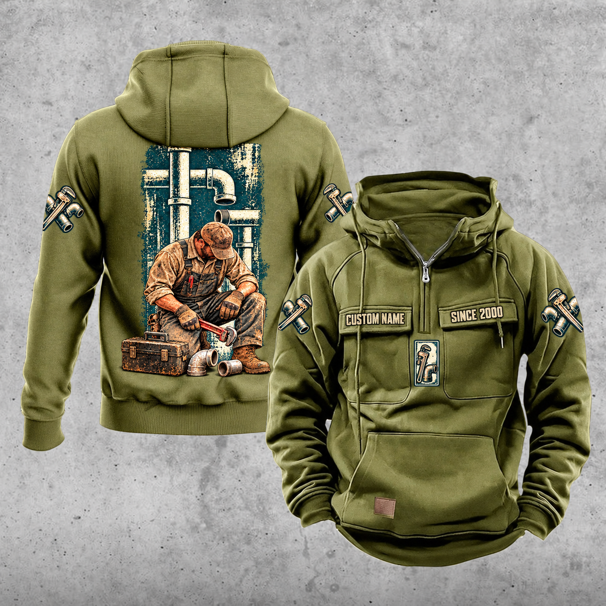 Plumber Daily Commitment Portrait Vintage Hoodie in Military Green, front and back views with sample chest text CUSTOM NAME and SINCE 2000, a tall pipework panel and kneeling plumber back illustration, and small wrench-and-fitting sleeve motifs.