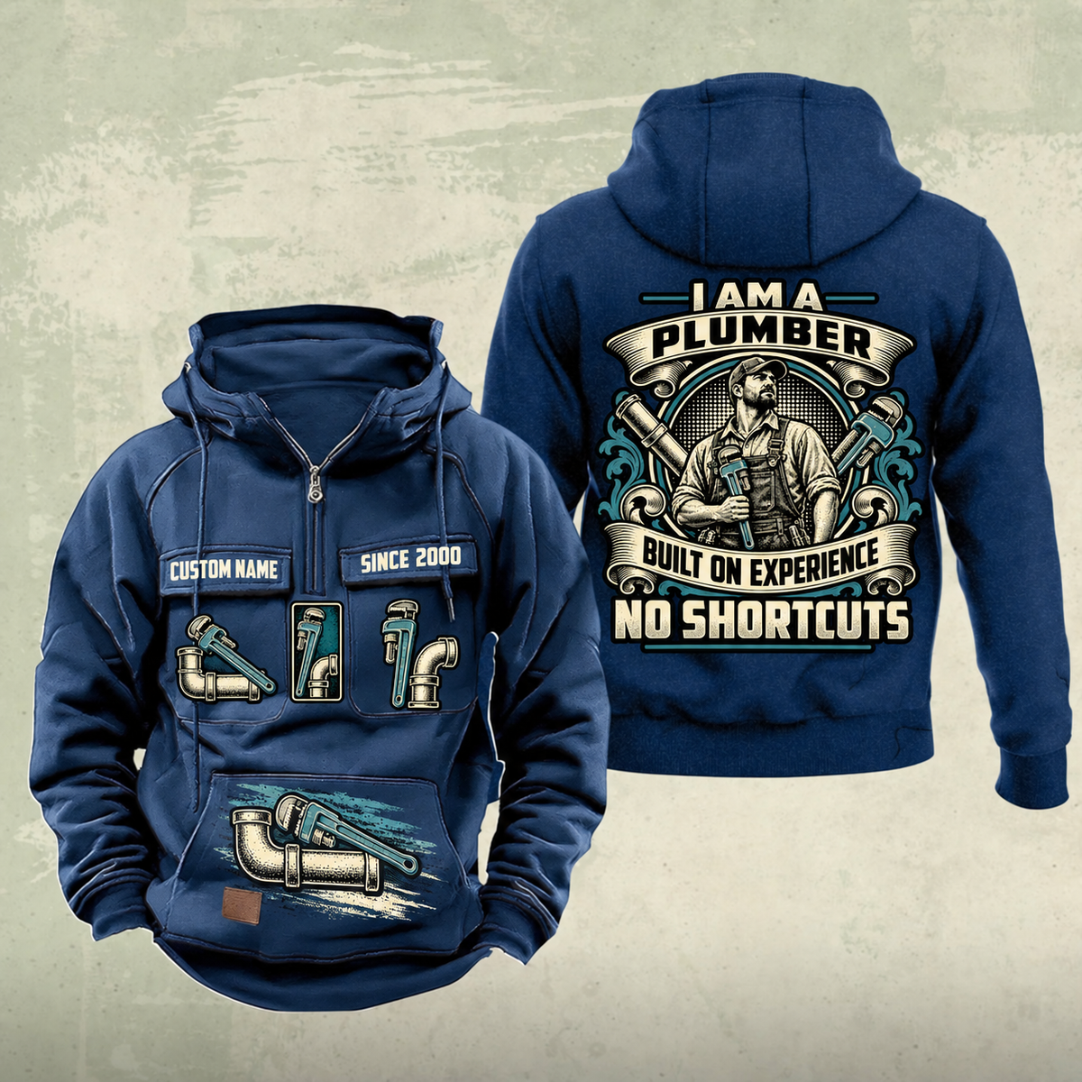 Plumber Heritage Crest Vintage Hoodie in Dark Blue, front and back views with cream and muted teal plumbing artwork and sample chest text CUSTOM NAME and SINCE 2000.