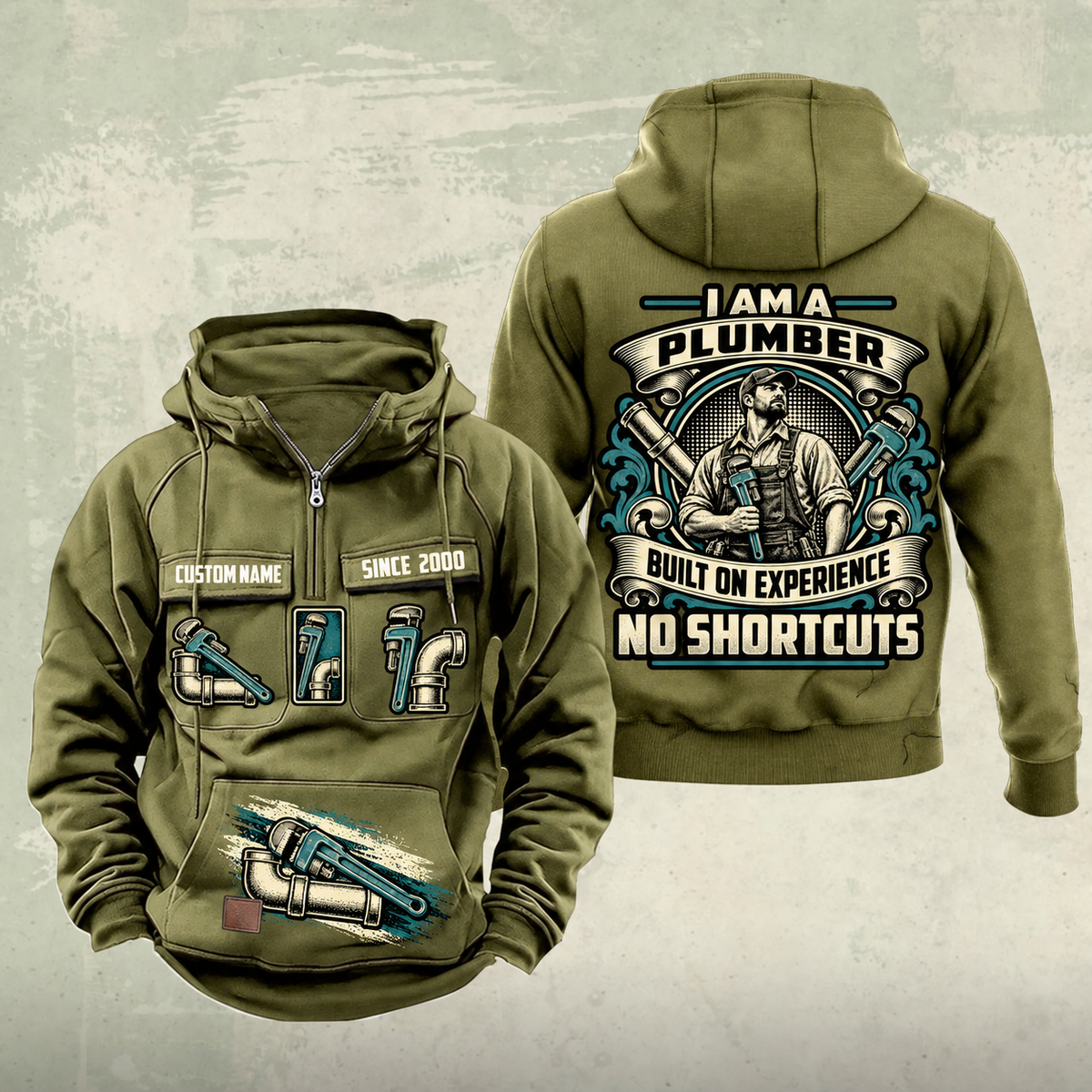 Plumber Heritage Crest Vintage Hoodie in Military Green, front and back views with cream and muted teal plumbing artwork and sample chest text CUSTOM NAME and SINCE 2000.