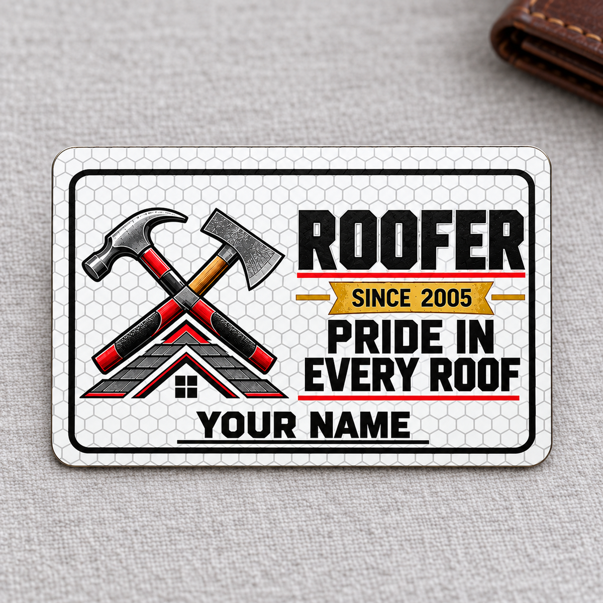 Front of the Roofer Honeycomb Pride aluminum wallet card on a subtle tabletop.
