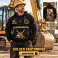 Excavator Operator wearing Golden Earthmover quarter-zip hoodie in their workplace; product introduction and shopping call to action