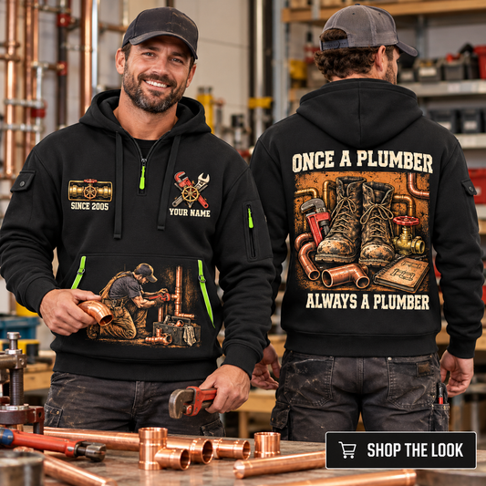 Plumber wearing Once A Plumber quarter-zip hoodie in their workplace; product introduction and shopping call to action