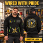 Electrician wearing Wired With Pride quarter-zip hoodie in their workplace; product introduction and shopping call to action