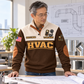 Adult model wearing the Brown HVAC Plan Measure Balance sports sweatshirt beside a drafting table in a planning studio