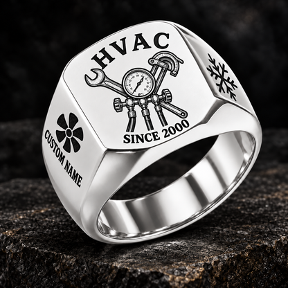 Silver HVAC Heritage Emblem signet ring featuring a pressure-gauge and service-tool emblem, with fan and snowflake shoulder details, with illustrative CUSTOM NAME and SINCE 2000