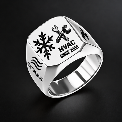Silver HVAC Split Emblem signet ring featuring an asymmetric snowflake and service-tool design, with airflow and flame shoulder details, with illustrative CUSTOM NAME and SINCE 2000