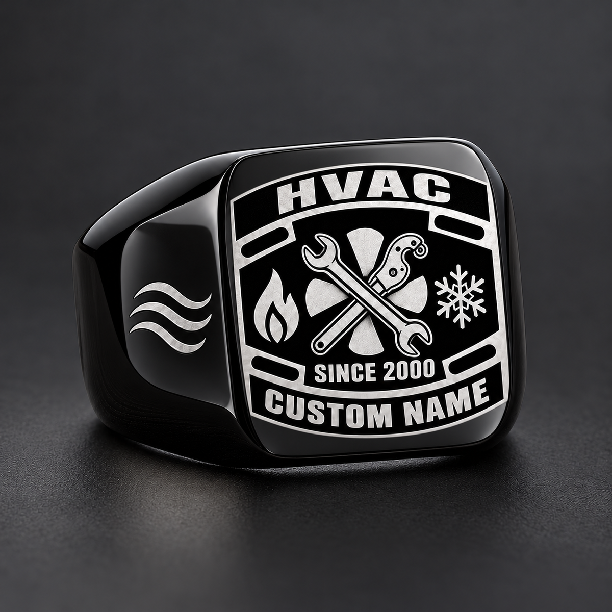 Black HVAC Black Face Badge signet ring featuring a dark badge-style face with a fan and service tools framed by heating and cooling symbols, with illustrative CUSTOM NAME and SINCE 2000