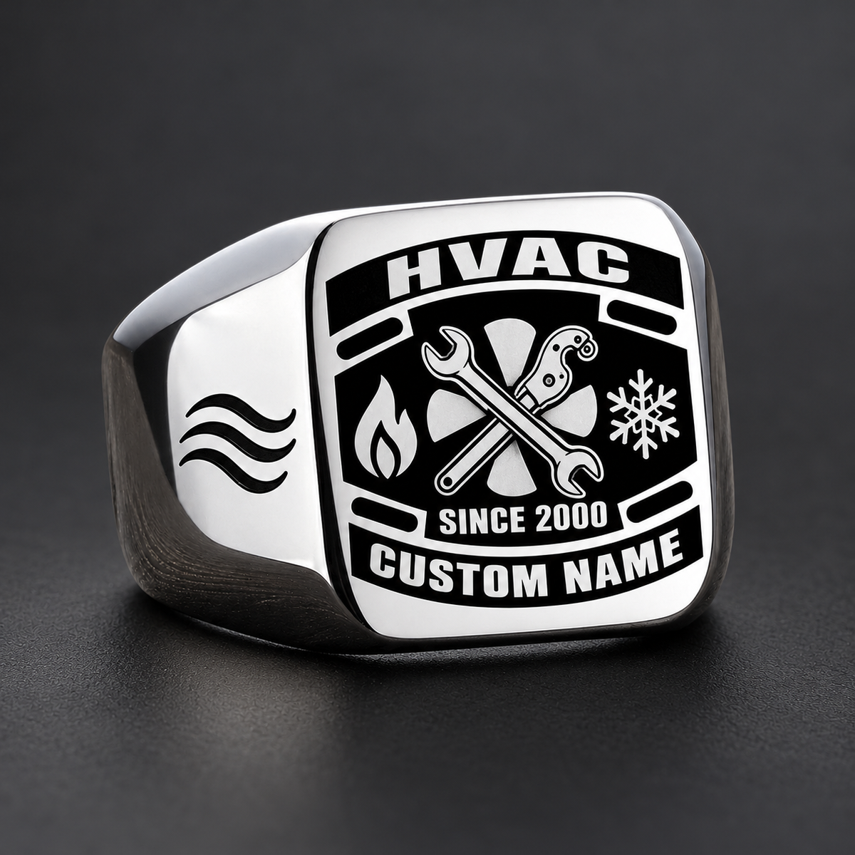 Silver HVAC Black Face Badge signet ring featuring a dark badge-style face with a fan and service tools framed by heating and cooling symbols, with illustrative CUSTOM NAME and SINCE 2000