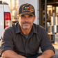 Personalized HVAC Diagonal Workshop Baseball Cap worn by an adult HVAC technician during a break