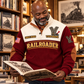 Personalized Railroader Track Perfection Sports Sweatshirt — Jujube Red, broad-shouldered bald adult with a short grey beard, standing and browsing a railway-history bookshop