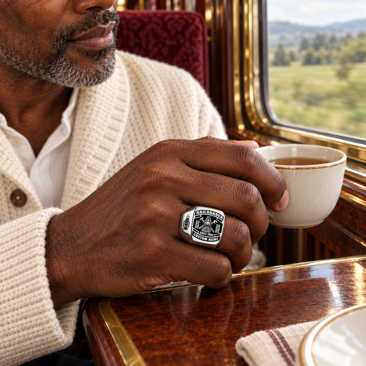 Silver Railroader Black Face Badge ring worn in a safe off-duty railway-themed leisure setting