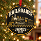 Railroader round ornament design concept hanging from a Christmas tree, with JAMES 2026 example text; not a sample photo