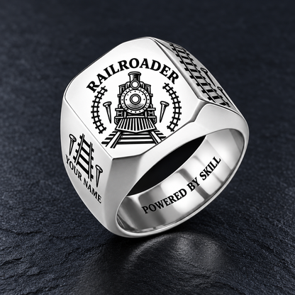 Silver Railroader Classic Emblem ring with locomotive, track and railroad-spike artwork and illustrative YOUR NAME and POWERED BY SKILL