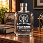 Railroader empty 20 oz glass bottle with a metal lid displayed at home beside railway keepsakes