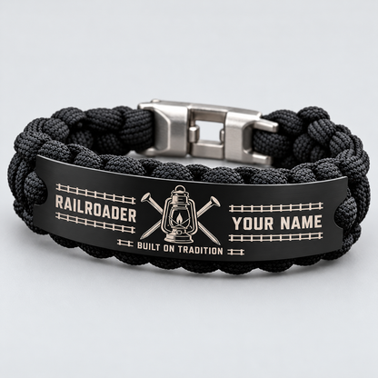 Standalone black Railroader bracelet with steel tag, visible silver shackle clasp, lantern and YOUR NAME preview