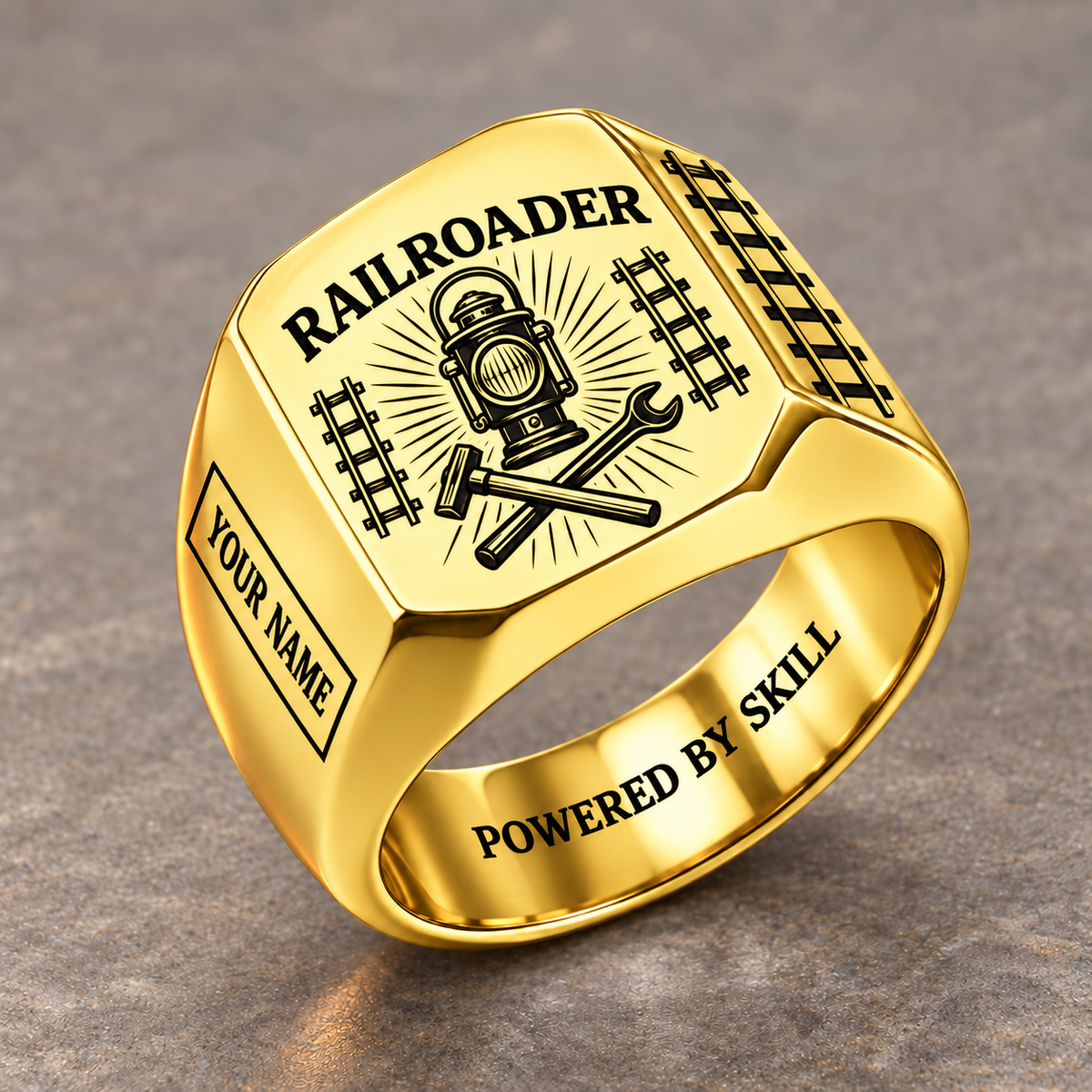 Gold Railroader Sunburst Legacy ring with railway lantern, crossed track tools and sunburst artwork and illustrative YOUR NAME and POWERED BY SKILL
