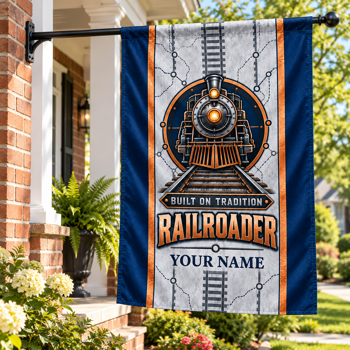 Railroader locomotive house flag hanging safely from a porch pole at a leafy brick home