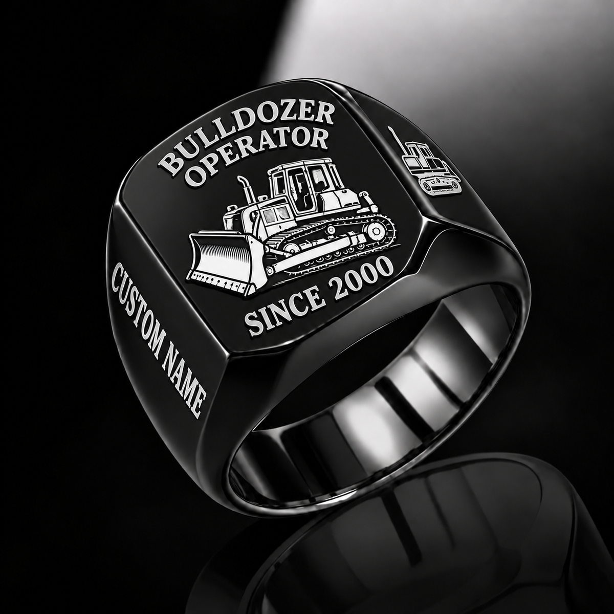 Bulldozer Operator Trade Emblem ring in Black, with tracked bulldozer artwork and sample CUSTOM NAME and SINCE 2000 engraving.