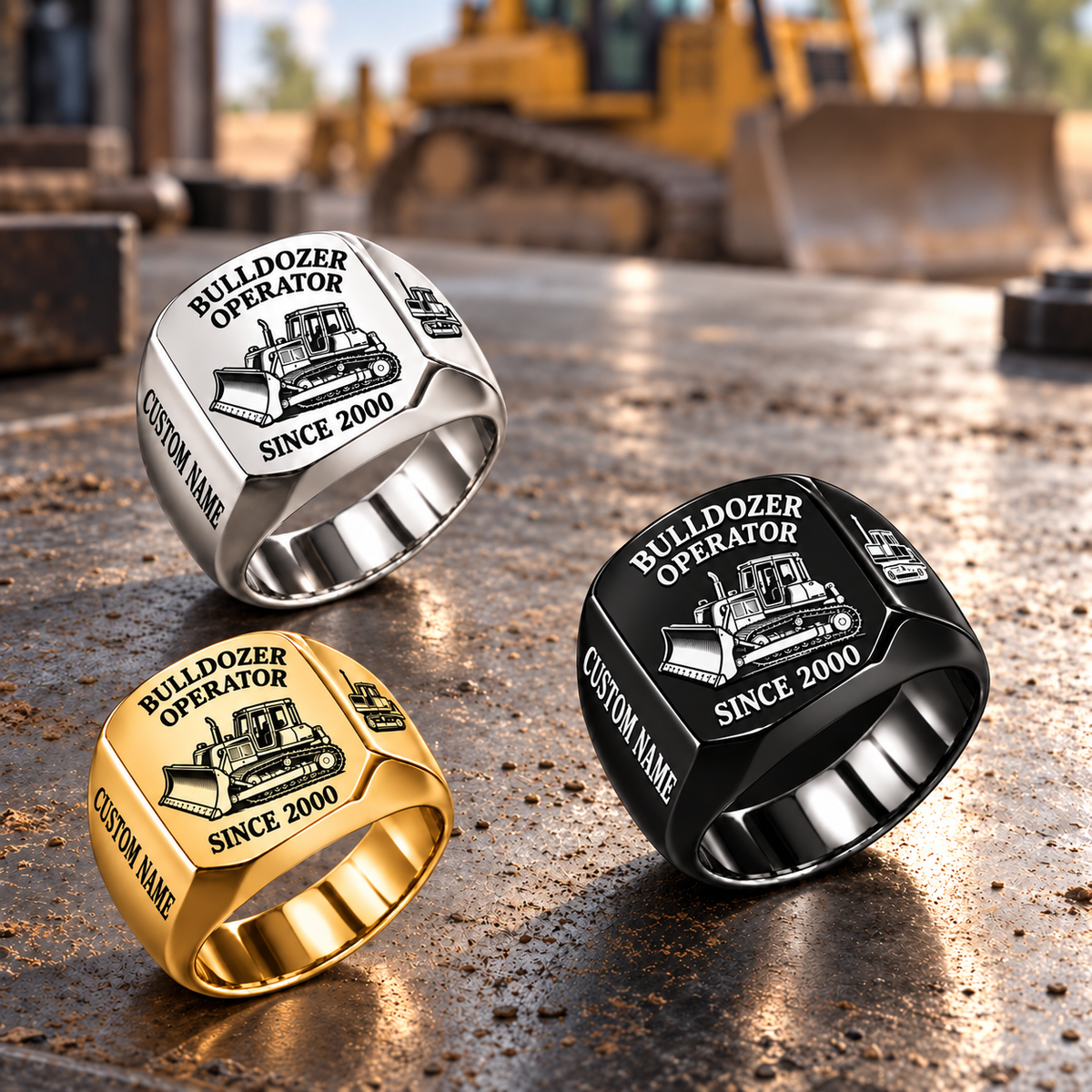 Bulldozer Operator Trade Emblem rings in Black, Silver and Gold on a construction workshop surface, with Black dominant and sample name-and-year artwork.