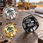 Black Bulldozer Operator Bold Lettering signet ring with smaller Silver and Gold inset views on a stationary heavy-equipment workbench; tracked bulldozer artwork and sample CUSTOM NAME and SINCE 2000 engraving.