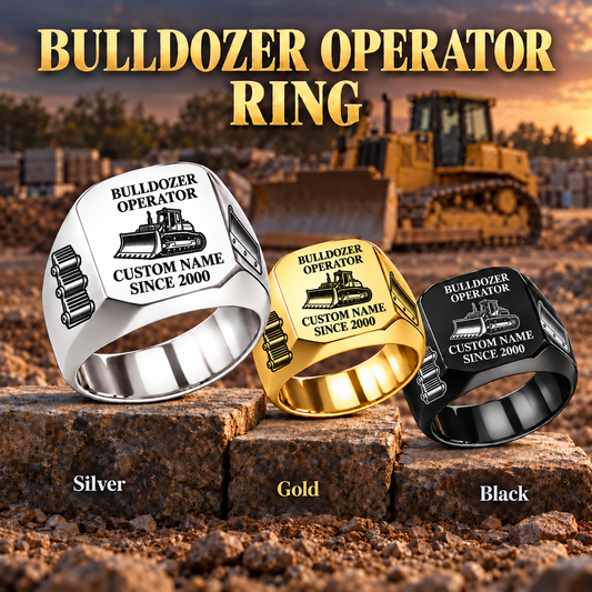 Bulldozer Operator Signature Crest ring in Silver, Gold and Black on a stepped stone display with a parked bulldozer in the background