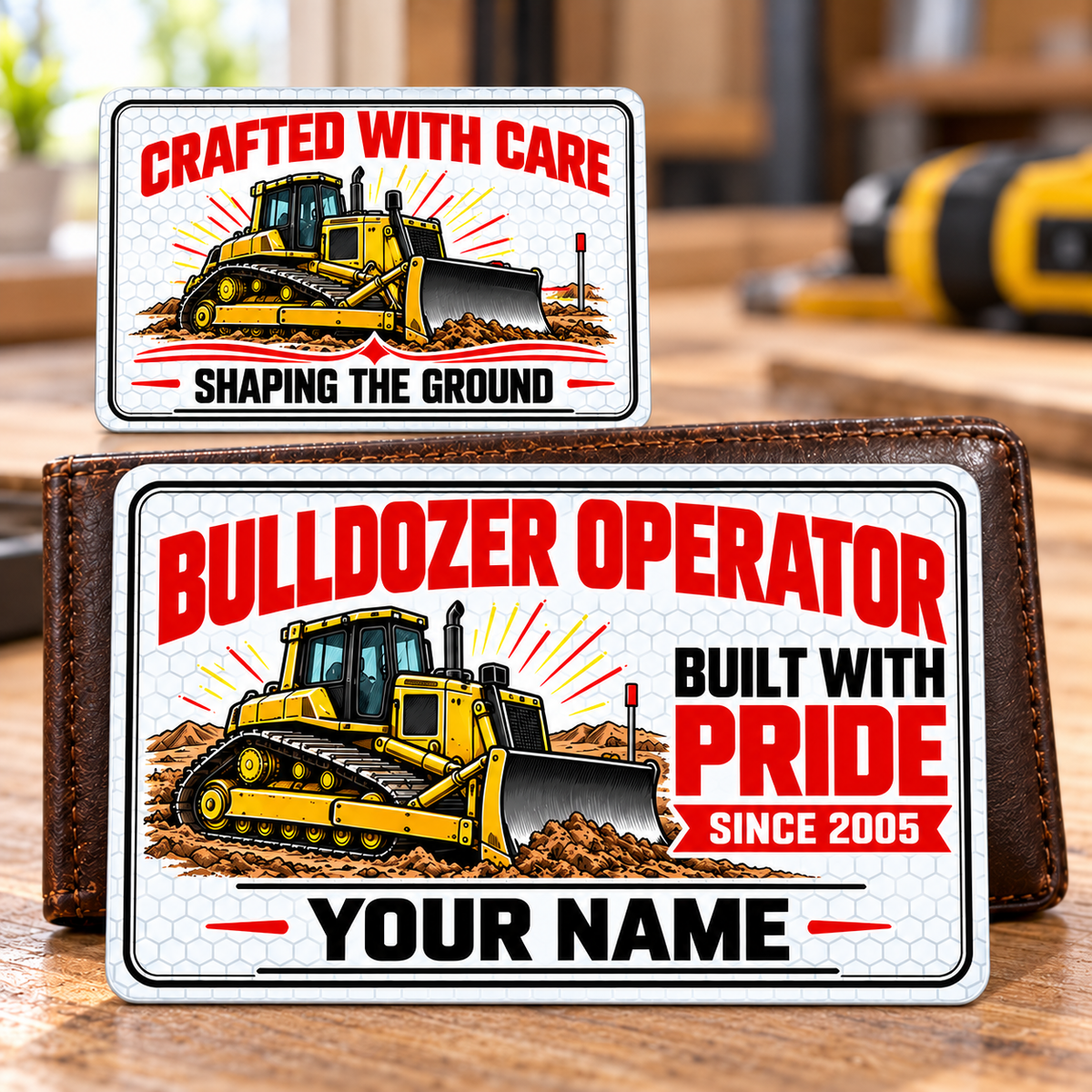 Front and reverse of the Bulldozer Operator Honeycomb Pride aluminum wallet card, with yellow tracked bulldozers, white honeycomb, black double borders and red trade-pride lettering; illustrative YOUR NAME and SINCE 2005 text.