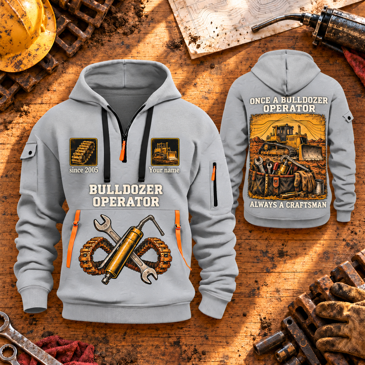Bulldozer Operator Lifelong Trade Quarter-Zip Hoodie in Light Grey, dominant front and smaller back views on a maintenance workbench, with tracked bulldozer, tool tote, crossed wrench and grease-gun artwork