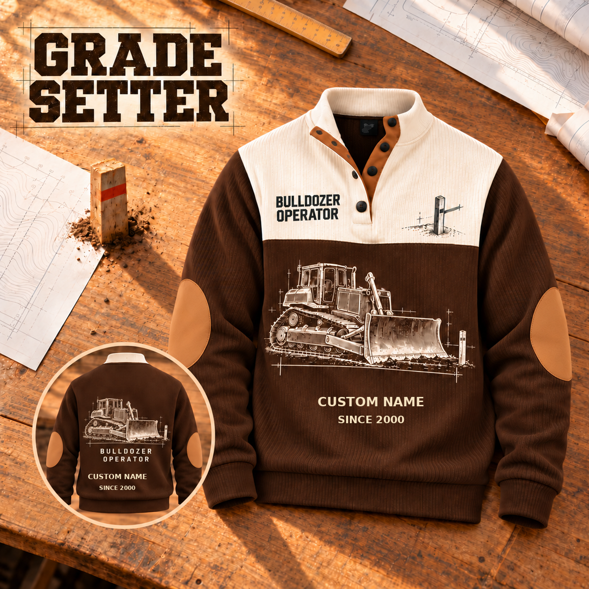 Bulldozer Operator Grade Setter Sports Sweatshirt in Brown, dominant front and smaller back view on a warm grade-planning tabletop, cream technical engraving of a tracked bulldozer with broad front blade, grade stake and drafting marks; fixed artwork; visible custom-name and SINCE 2000 sample text on the garment.