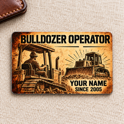Front of the Bulldozer Operator Sepia Legacy aluminum wallet card on cream linen, with an archival operator scene, a tracked bulldozer and illustrative YOUR NAME and SINCE 2005 text.