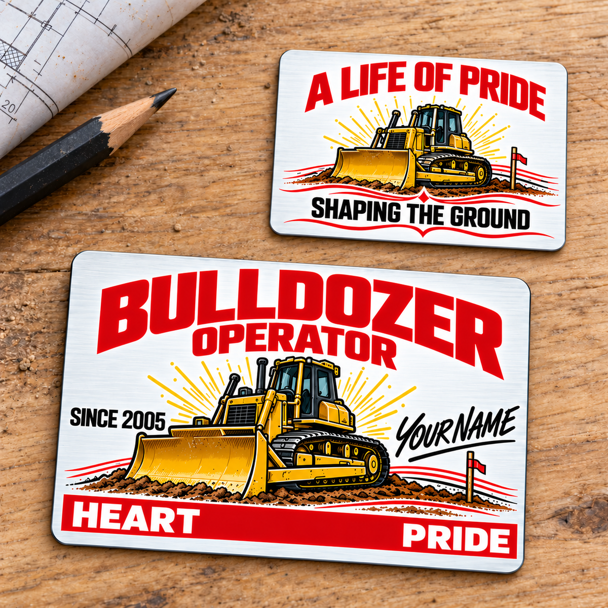 Front and reverse of the Bulldozer Operator Signature Classic aluminum wallet card on an oak workbench, with white-and-red Heart and Pride artwork, a yellow tracked bulldozer and Shaping the Ground on the reverse.