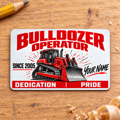 Front of the Bulldozer Operator Signature Modern aluminum wallet card on pale wood, with red and graphite bulldozer artwork, illustrative name and year, and a red Dedication and Pride footer.