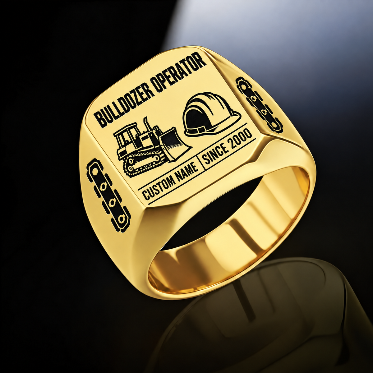 Gold Bulldozer Operator Twin Icons signet ring with tracked bulldozer and hard-hat symbols, track-link shoulders, plain inner band, and sample CUSTOM NAME and SINCE 2000 engraving.
