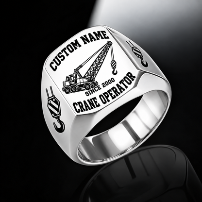 Silver-finish Crane Operator Bold Lettering signet ring with lattice-boom crane and shoulder hoist-hook artwork, with illustrated CUSTOM NAME and SINCE 2000 text