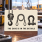 Ivory reverse of the Crane Operator Patient Hands aluminum wallet card, with black crane hook block, wire-rope sling and shackle illustrations above The Care Is in the Details.