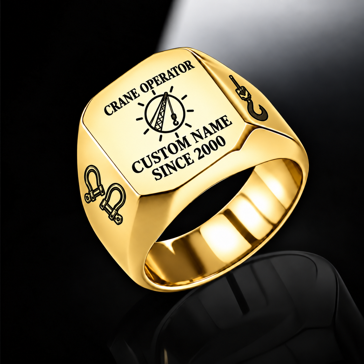 Gold-finish Crane Operator Signature Crest signet ring with circular crane-hoist crest, shoulder shackles and lifting hook, and illustrated CUSTOM NAME and SINCE 2000 text