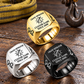 Crane Operator Signature Crest rings in a Gold-led triangular arrangement with Silver and Black finishes on a staged rigging tabletop