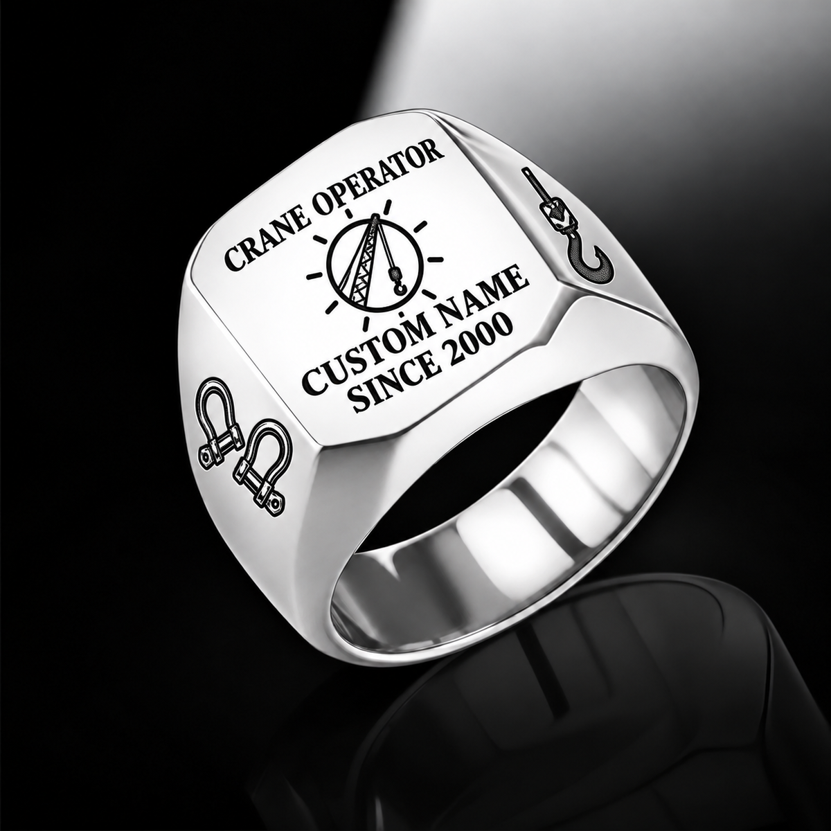 Silver-finish Crane Operator Signature Crest signet ring with circular crane-hoist crest, shoulder shackles and lifting hook, and illustrated CUSTOM NAME and SINCE 2000 text