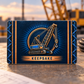 Reverse of the Crane Operator Toolmark Heritage aluminum wallet card, with matching lattice-boom crane, suspended hook, blue rays and a copper Keepsake banner on a navy background.