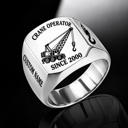Silver-finish Crane Operator Trade Emblem signet ring with lattice-boom crane, suspended hoist, shoulder hook and illustrated CUSTOM NAME and SINCE 2000 text