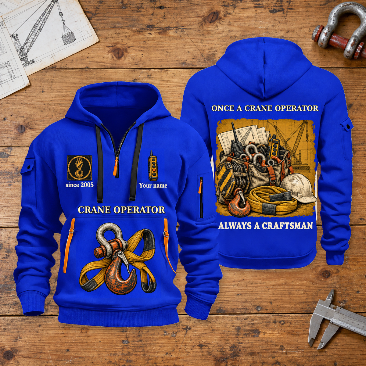 Crane Operator Trade For Life Quarter-Zip Hoodie in Blue, full authentic front and back views with matching crane operator tools and equipment artwork, original sample name/year, niche-specific ONCE A headline and original ALWAYS A CRAFTSMAN footer. On a crane operator workbench.