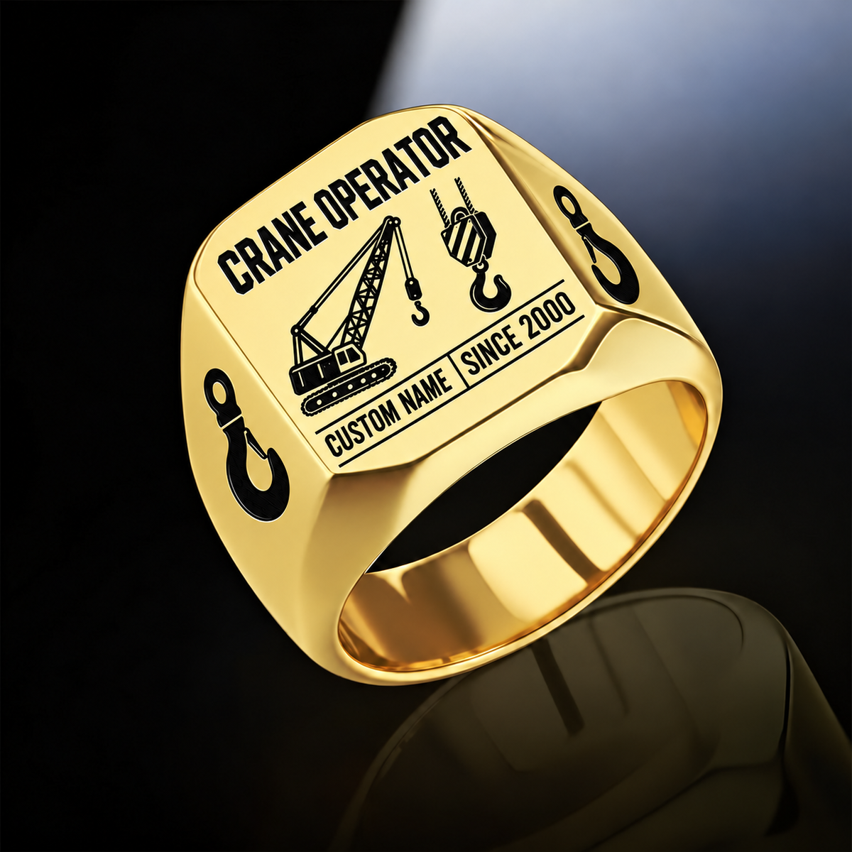 Gold-finish Crane Operator Twin Icons signet ring with lattice-crane and hoist-hook emblems, shoulder hooks and illustrated CUSTOM NAME and SINCE 2000 text