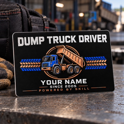 Midnight Pride dump truck driver aluminum wallet card standing on a grey dispatch bench, with black, blue and copper front artwork.