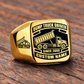 Gold-finish Dump Truck Driver Black Face Badge ring with high-sided tipping-bed truck artwork, matching shoulder truck, and illustrated CUSTOM NAME and SINCE 2000 text